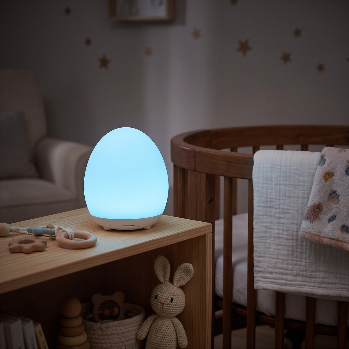 Egg night light glowing blue on a nursery shelf