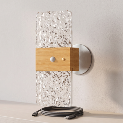 Close-up of the night light, its sensor and magnetic wall plate