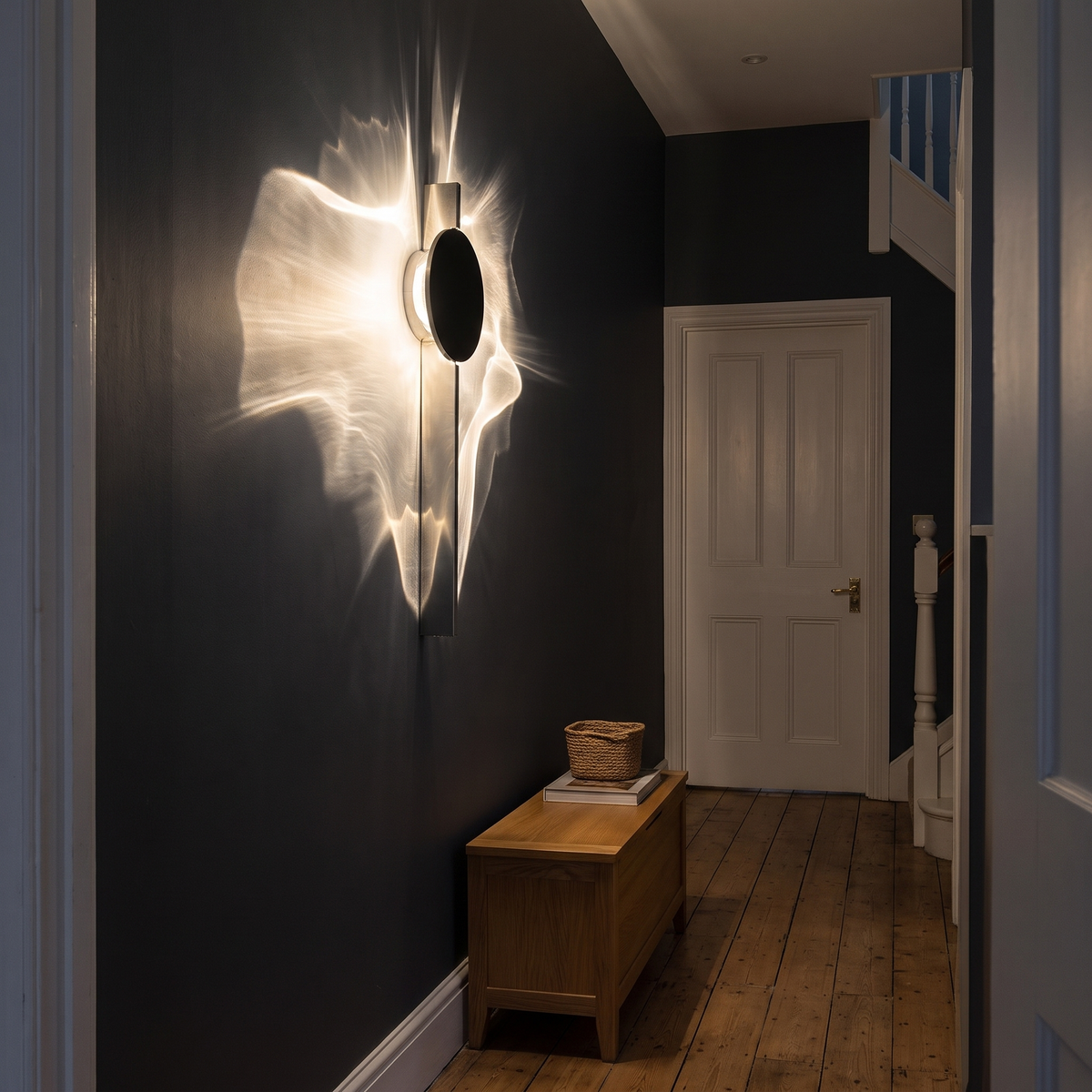 Water ripple wall light on a dark hallway wall