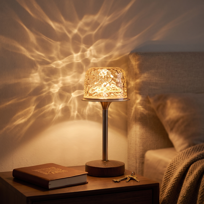 Water ripple lamp with walnut base on a bedside table